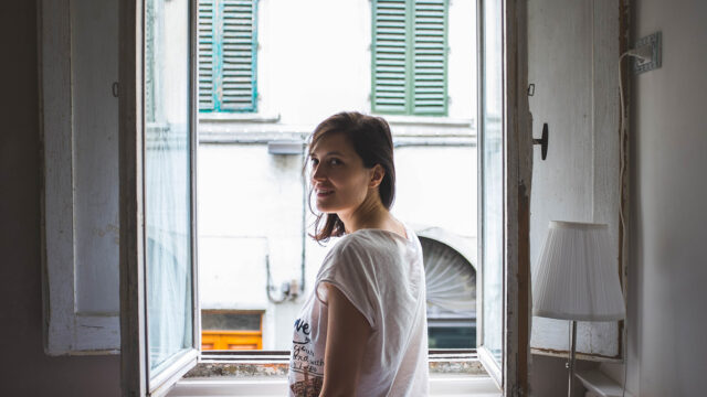 Woman with White Short at the Window