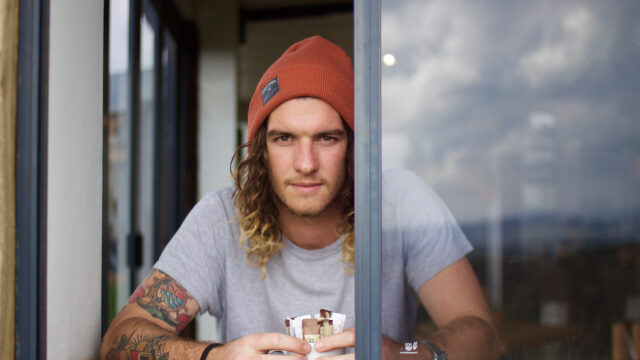 Man Looking Out the Window