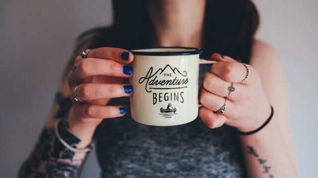 Girl with Tattoo Holding a Mug